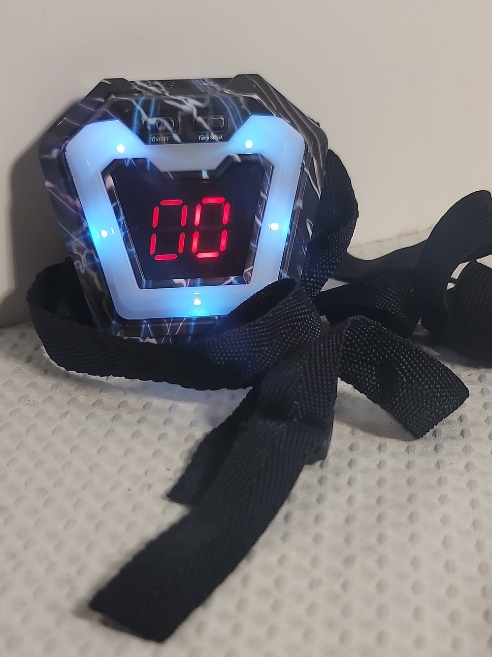 White Electronic Device with Black Woven Strap
